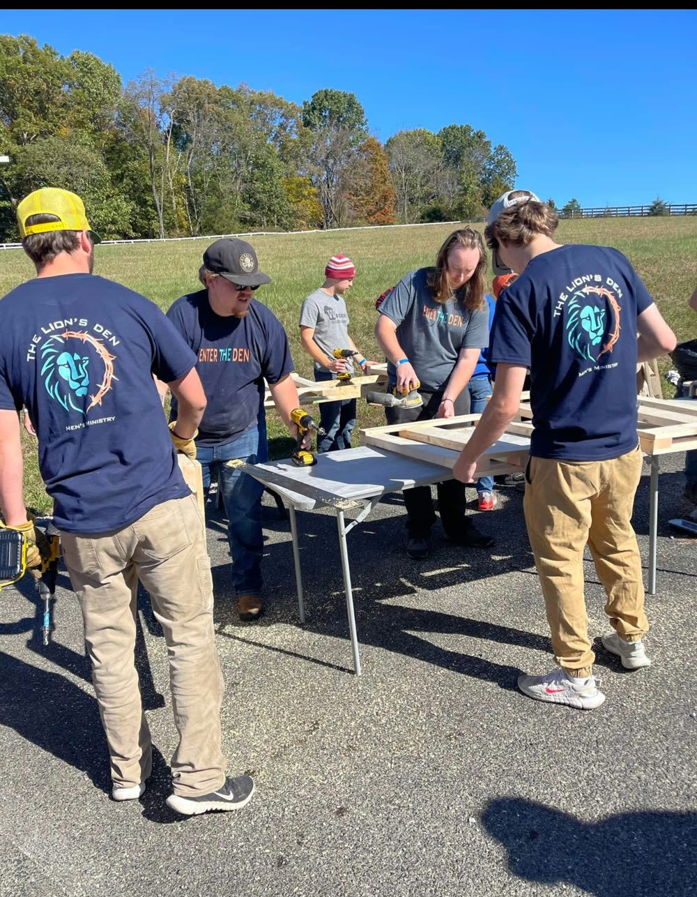 Members framing a project together on a build day